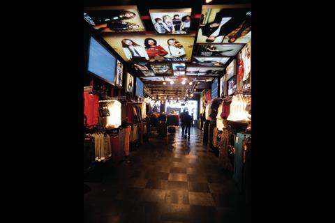 The store features screens showing the retailer’s latest campaign content